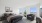 Bright and spacious bedroom with a plush bed, modern furniture, and large windows offering stunning views.