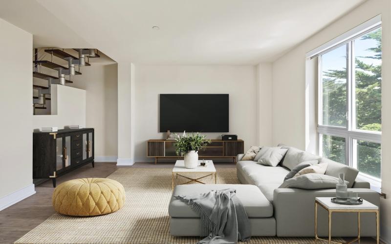 a living room with a tv and couches