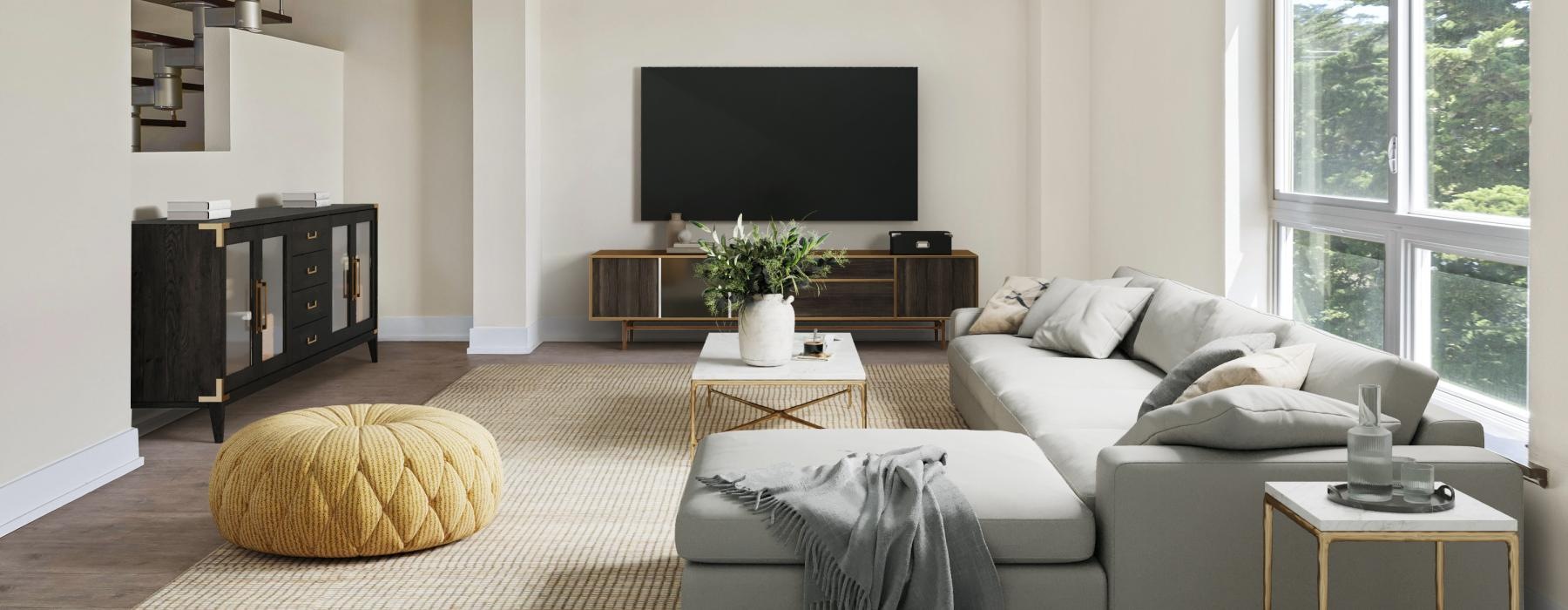 a living room with a tv and couches